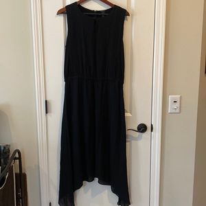 Elegant sheer georgette handkerchief hem dress over black knit, pleated bodice